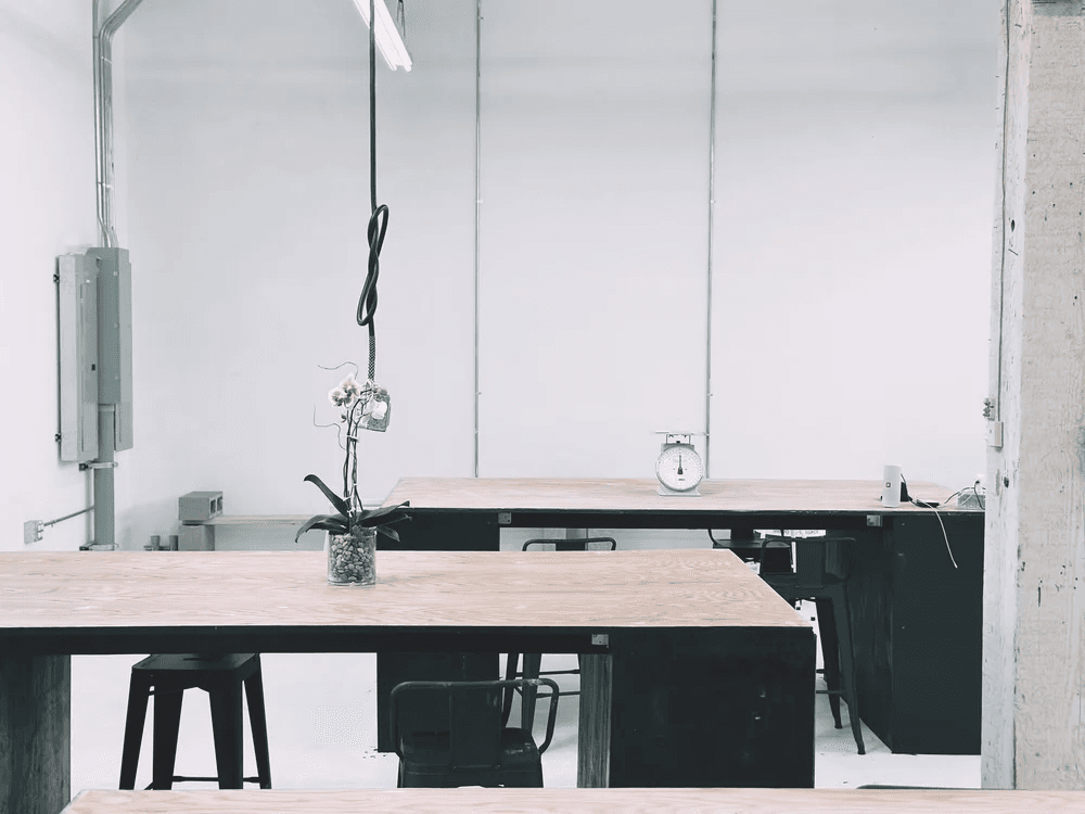 Bright work tables inside MUD Ceramics Studio